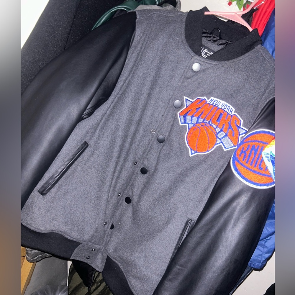 Size medium in mens black and grey heavy varsity jacket